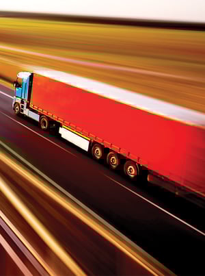 transportation-hero-rd2-green-truck-red-trailer-open-road-long-exposure