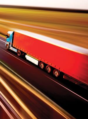 transportation-hero-rd2-green-truck-red-trailer-open-road-long-exposure